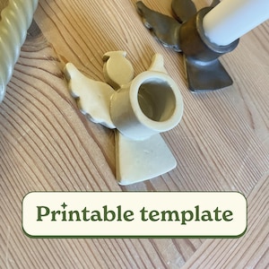 May include: Printable template for a ceramic angel candle holder. The holder is white with a round opening for a candle. The angel has wings and a halo.