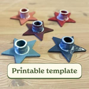 May include: A collection of star-shaped candle holders in various colors, including red, blue, and brown. Each holder has a cylindrical opening for a candle. The image also includes the text "Printable template".