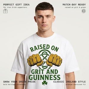 May include: White t-shirt with the text "RAISED ON GRIT AND GUINNESS" in green. The design includes two fists and a Celtic knot. Additional text includes "SHOW YOUR IRISH PRIDE" and "CLASSIC IRELAND STYLE".