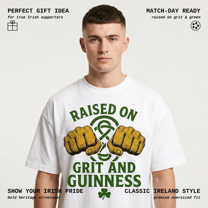 May include: White t-shirt with the text "RAISED ON GRIT AND GUINNESS" in green. The design includes two fists and a Celtic knot. Additional text includes "SHOW YOUR IRISH PRIDE" and "CLASSIC IRELAND STYLE".
