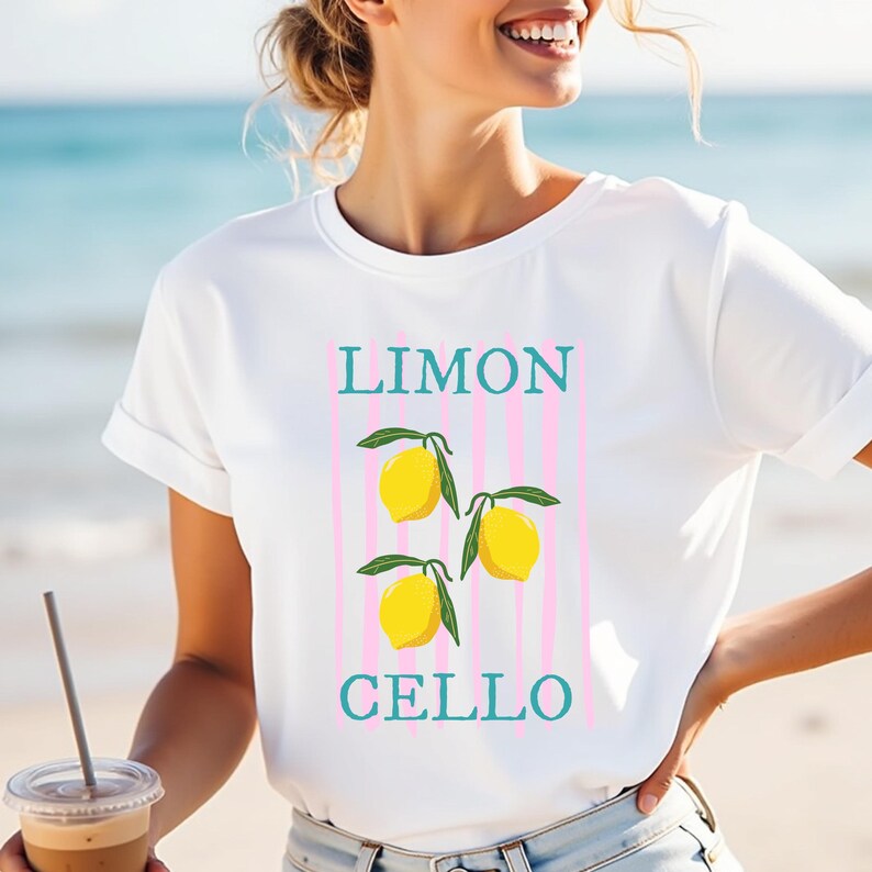 May include: White t-shirt with a graphic of lemons and the text "LIMON CELLO" in blue and pink.