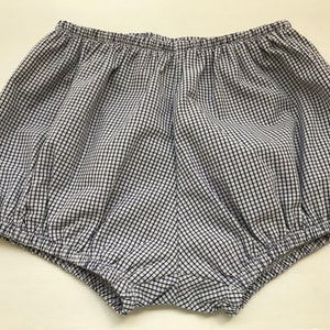 May include: White and blue gingham baby bloomers with a gathered elastic waistband.