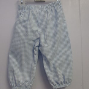 May include: Blue and white gingham pants with a gathered elastic waistband.