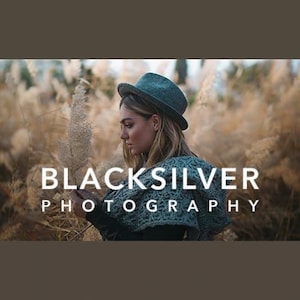May include: A woman wearing a teal blue hat and a teal blue knitted sweater with the text "BLACKSILVER PHOTOGRAPHY" in white letters.