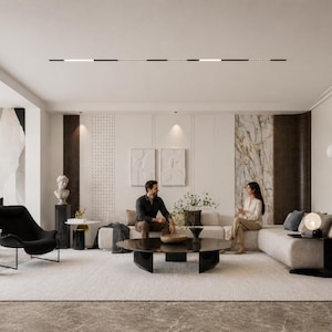 May include: A modern living room with a neutral color palette. Features include a large sectional sofa, a black armchair, a round coffee table, and decorative wall art. The room is well-lit with natural and artificial lighting, creating a comfortable and stylish space.