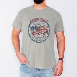 Vintage American Teacher Shirt, Patriotic USA Flag, Shaping Futures Since 1776 Tee Ivory