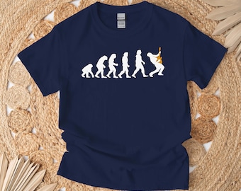May include: A navy blue t-shirt featuring a white graphic of the evolution of man, culminating in a man playing an electric guitar.