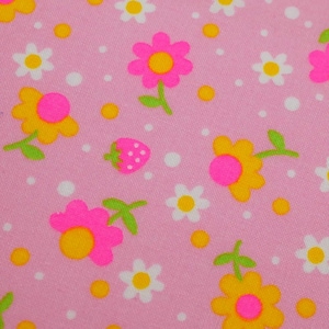 May include: Pink fabric with a repeating pattern of flowers, strawberries, and polka dots. The flowers are yellow and pink with green stems and leaves. The strawberries are pink with green tops, and the polka dots are white and yellow.