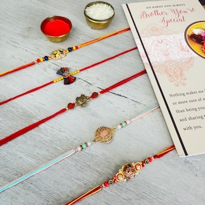 Handmade Om Rakhri Bracelet | Raksha Bandhan Friendship Band | Free Size Adjustable Gift | Sacred Thread of Love –  | Gifts for Brother