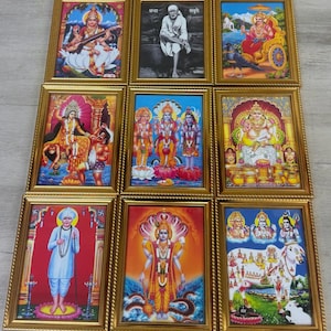 May include: A collection of nine framed religious prints, each in a gold-coloured frame with an ornate border. The images showcase Hindu deities and spiritual figures in vivid colours. Ideal for home decoration or spiritual purposes.