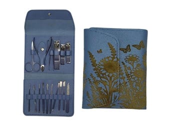 May include: A blue leather case with a floral design and a set of nail clippers, scissors, and other tools inside.