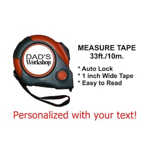 May include: An orange and black measuring tape with the text "DAD'S Workshop" on the front. The tape measure is 33ft/10m, has an auto-lock, a 1-inch wide tape, and is easy to read. The text "Personalized with your text!" is also visible.