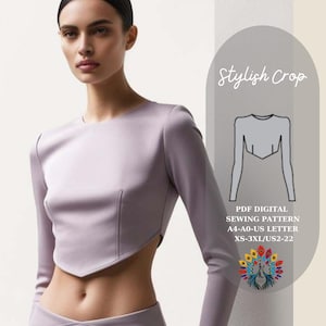 以下が含まれることがあります： 長袖のスタイリッシュなクロップトップのデジタル裁縫パターン。パターンはXS-3XLサイズで、A4-A0-USレター用紙に印刷されています。