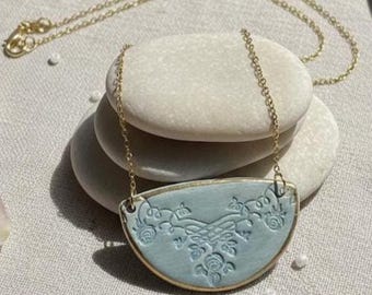 Handmade Aqua Ceramic Necklace – Floral Embossed Half-Moon Pendant