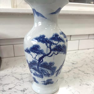 Vintage cantonware style blue and white 10.5in tall vase.  Marked: Hand crafted Thailand.