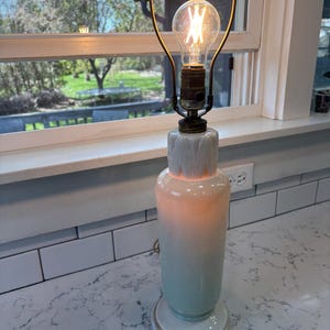 Rare vintage 1940s Aladdin dual light alcite glass pale green and ivory tall table lamp.