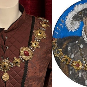 May include: A close-up of a gold and red jeweled necklace with a large pendant. The necklace is worn by a person in a brown quilted jacket. The image also shows a portrait of a man wearing a similar necklace. The portrait is dated 1536.