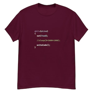 May include: Burgundy t-shirt with white text that reads: "while(alive) { eat(food); //sleep(8*3600*1000); writeCode(); }"