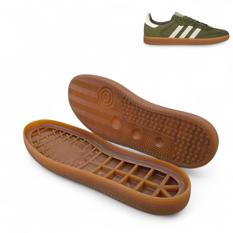 May include: Olive green sneakers with white stripes and a brown sole. The image also shows the brown rubber soles of the sneakers. The sneakers have a classic design, suitable for casual wear.