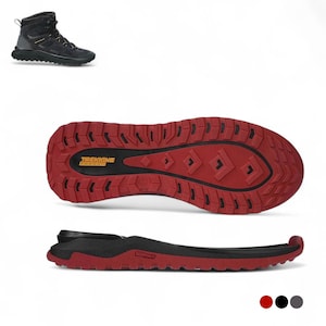 May include: Black hiking boot with orange accents, shown from multiple angles. The sole is red with a black center and the text "TREKKING ADVENTURE". The insole is also shown. Outdoor footwear.