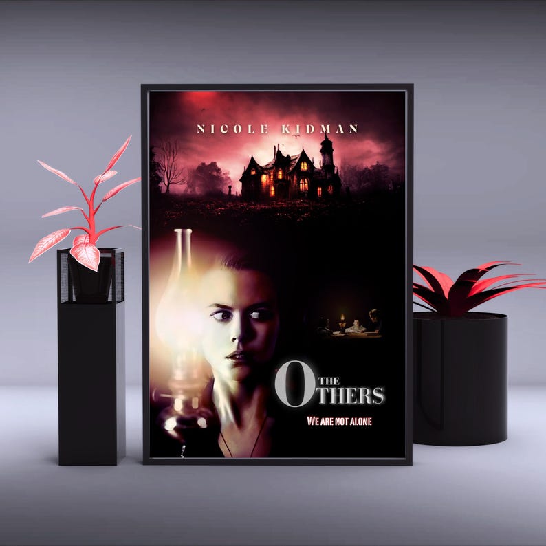 May include: Movie poster for the film "The Others" starring Nicole Kidman. The poster features a woman holding a lantern in front of a dark, ominous house. The text "The Others" is in large, white letters with the tagline "We are not alone" below.