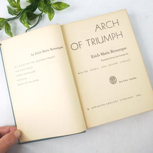old book Arch of Triumph by Erich Maria Remarque, 1945 antique German hardback fiction book, aged blue book cover