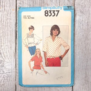 May include: Vintage Simplicity sewing pattern 8337 for young junior/teen sizes 11/12. The pattern features illustrations of blouses and tops. The cover is blue with the Simplicity logo and price.