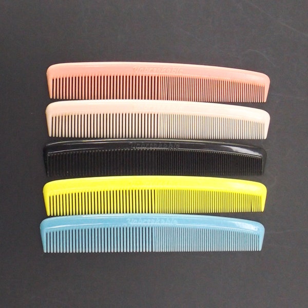 vintage NOS unbreakable hair comb, 70s 80s vintage, hair styling accessories, nylon plastic comb, blue, yellow, black, pink