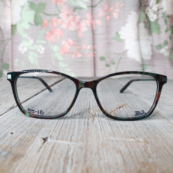 green tortoiseshell eyeglass frames plastic/metal… - image 1