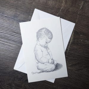 kind bidden kerstkaart vintage stationaire wenskaart ann adams tekening schets zwart en wit new old stock vreugde vrede kleine baby