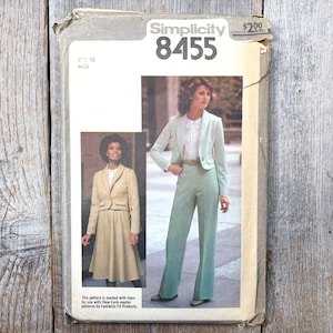 May include: Vintage Simplicity 8455 sewing pattern for a Misses' suit. The pattern features a jacket and pants or skirt. The cover shows a woman wearing a light green suit with a white blouse. Size 10.