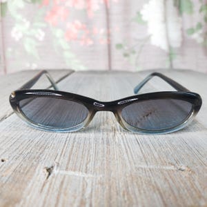 blue colored lens sunglasses silver accent deadstock vintage unisex/men/women slim/skinny 1990s fashion accessories 90s eyewear nos sunglass