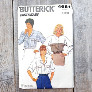 May include: A vintage Butterick sewing pattern, model 4651, featuring illustrations of women's blouses. The pattern cover displays three blouse designs with different styles and details. The text "FAST & EASY" is prominently displayed.