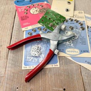vintage collection of snap fasteners with tool for fastening diy sewing supplies no sew