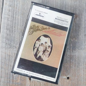 Cinta de casete de música country de 1976 Lo mejor de los cantantes de Statler Brothers Mercury Records flores en la pared