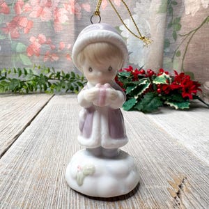Porcelain precious moments christmas ornament music box play a holiday song push button decorative little boy holding a present