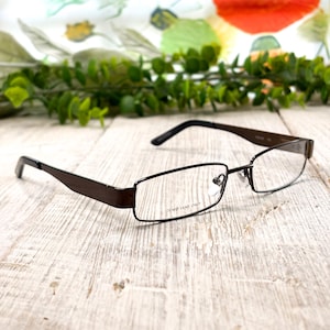 May include: A rustic wooden sign with the text "Welcome to our home" in a handwritten style. The sign features a distressed finish and a simple, inviting design, perfect for a front porch or entryway.