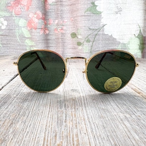 1990s round sunglasses dark black glass lenses uv protection gold or tortoise metal frames