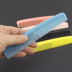 vintage NOS unbreakable hair comb, 70s 80s vintage, hair styling accessories, nylon plastic comb, blue, yellow, black, pink