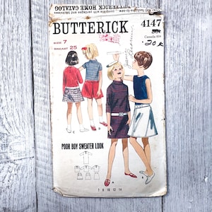 May include: Vintage Butterick sewing pattern 4147, featuring illustrations of children's clothing. The pattern includes a "Poor Boy Sweater Look" design, with sizes 7 and breast 25. The cover is aged with visible wear and tear.