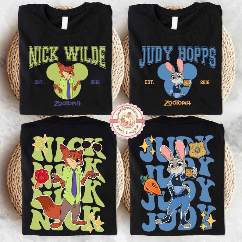May include: Four black t-shirts featuring characters from Zootopia. Two shirts display "Nick Wilde" and "Judy Hopps" with character illustrations and the text "EST. 2016" and "Zootopia". The other two shirts have similar designs.