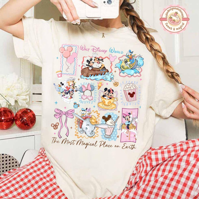 May include: Cream-colored t-shirt featuring a colorful collage of Disney characters and attractions. The design includes Mickey and Minnie Mouse, Dumbo, and other characters, with the text "Walt Disney World" and "The Most Magical Place on Earth."