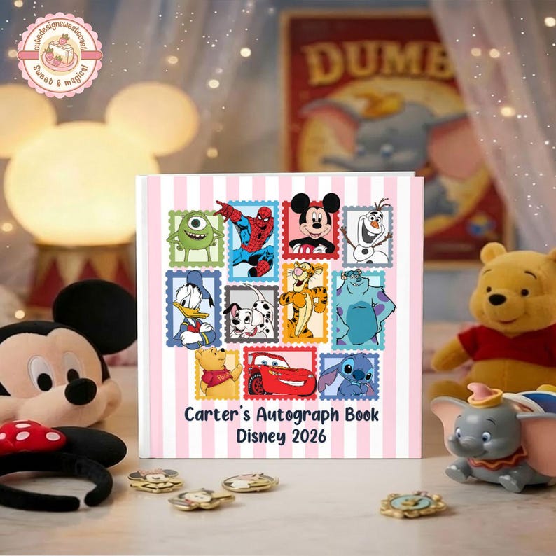 May include: A square autograph book with a light pink and white vertical striped background. The cover features a collage of cartoon character illustrations in stamp-style frames and the text "Carter's Autograph Book Disney 2026" in black.