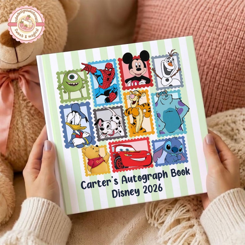 May include: A square autograph book with a light green and white striped cover featuring various cartoon characters in postage stamp frames. The text reads Carter's Autograph Book Disney 2026. Characters include Mickey Mouse, Spider-Man, and Winnie the Pooh.
