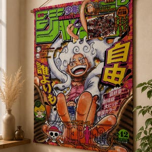 以下が含まれることがあります： 日本の漫画シリーズ、ワンピースの鮮やかなイラストが描かれた壁掛け。 白い髪とオレンジ色の肌のキャラクターが、日本語のテキストが書かれたカラフルな背景に描かれています。 タペストリーは木の棒から吊り下げられています。