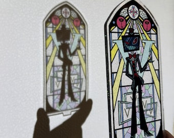 May include: A stained-glass style acrylic panel featuring a cartoon character with a television for a head, wearing a black suit and red bow tie. The panel is in the shape of a church window with a colorful design and the letter "V".