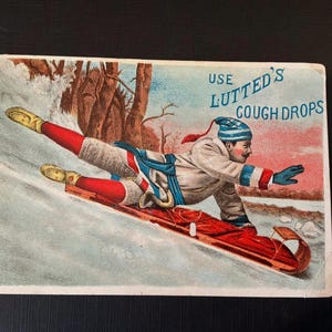 Tarjeta publicitaria victoriana del jarabe para la tos Lutted's, carreras de trineos