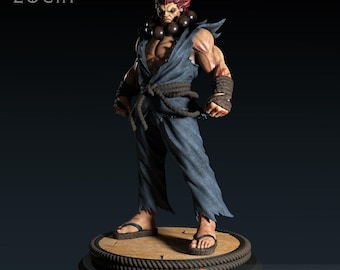 May include: A detailed figurine of a muscular character with red hair and a stern expression, wearing a blue gi and sandals. The figure has a rope belt and wrist wraps. The base is round with a rope trim. The text "LORD ZOCHI" is at the top left.