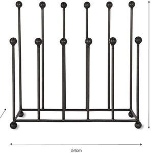 May include: A black metal boot rack with a rectangular base and vertical supports topped with decorative spheres. The rack is 20cm deep, 54cm wide, and 52cm tall, designed to hold multiple pairs of boots.