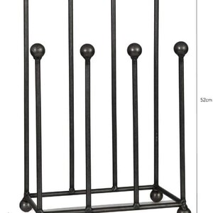 May include: A black metal boot rack, 20cm wide, 33cm long, and 52cm tall. The rack has a rectangular base with rounded feet and vertical rods topped with spherical finials. The design is simple and functional for organizing footwear.